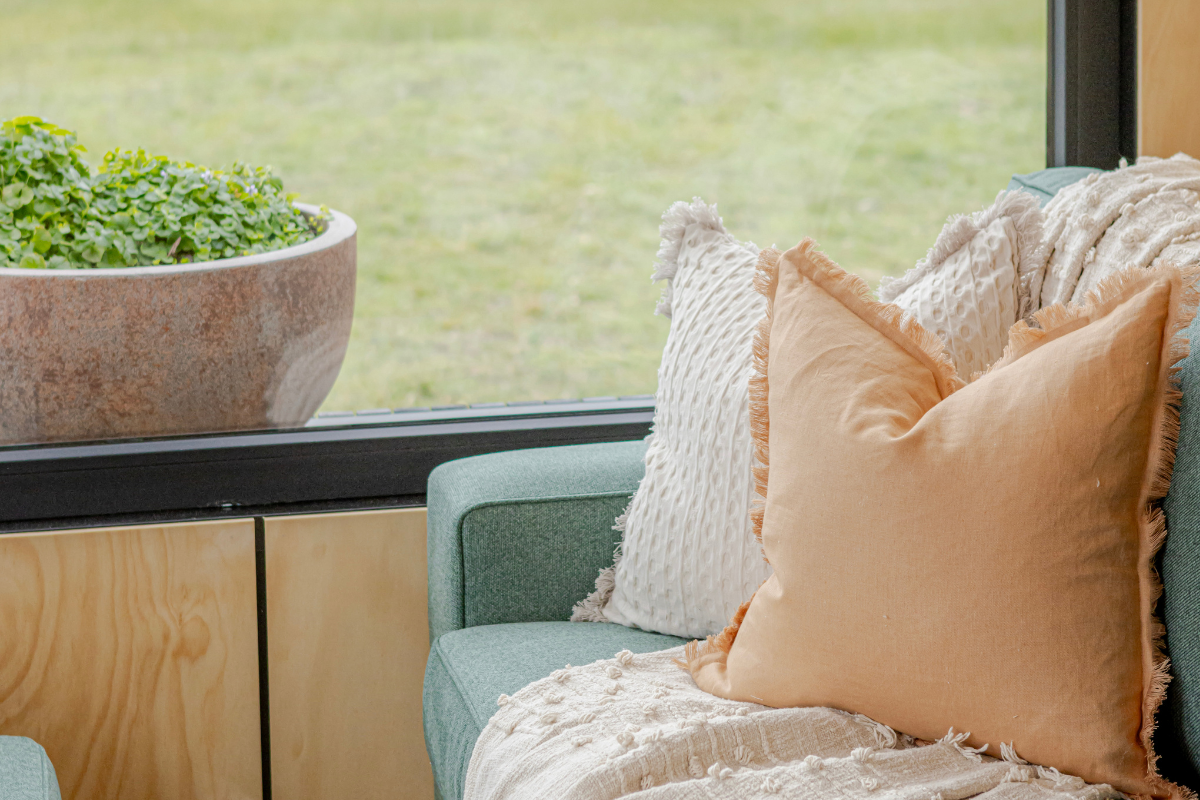 6 m tiny home on wheels couch and window